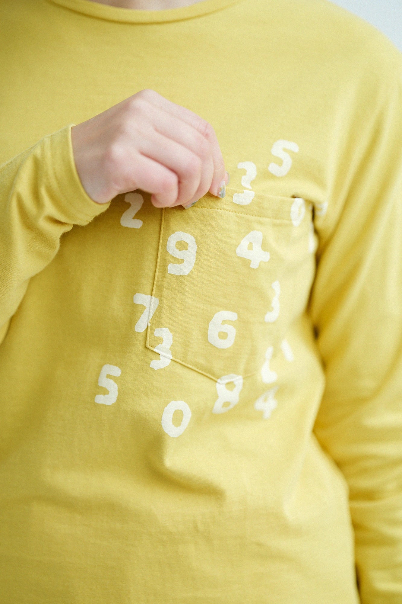 Plattiertes Jersey-Langarm-T-Shirt mit Taschen/Gelb